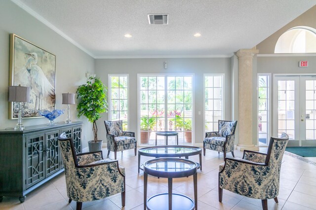 236 Village Blvd Unit 1303, Tequesta, FL 33469 - living area featuring a textured ceiling, ornate columns, french doors, recessed lighting, and ornamental molding