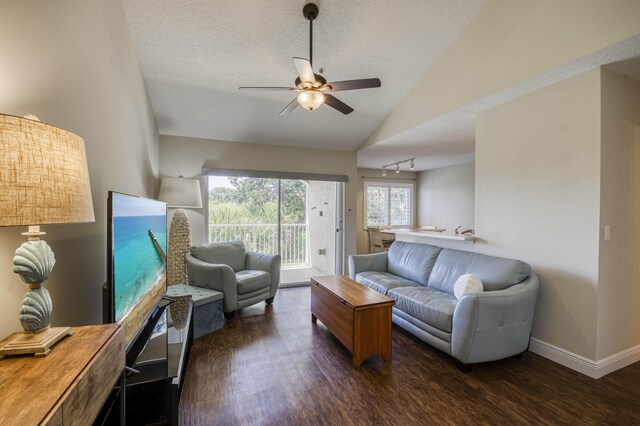 236 Village Blvd Unit 1303, Tequesta, FL 33469 - living area with dark wood-type flooring, lofted ceiling, ceiling fan, a textured ceiling, and baseboards