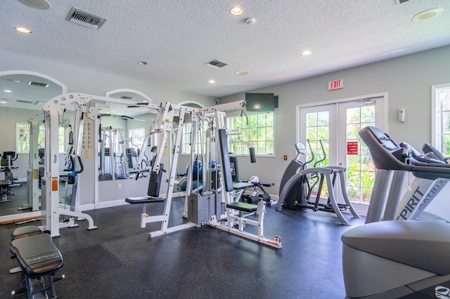 236 Village Blvd Unit 1303, Tequesta, FL 33469 - workout area with recessed lighting, a textured ceiling, baseboards, and french doors