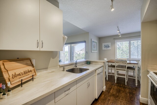 236 Village Blvd Unit 1303, Tequesta, FL 33469 - kitchen featuring a sink, white appliances, light countertops, dark wood-style floors, and white cabinets
