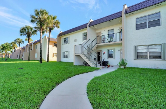 130 Lake Meryl Dr Unit 226, West Palm Beach, FL 33411 - view of property's community featuring stairs and a yard