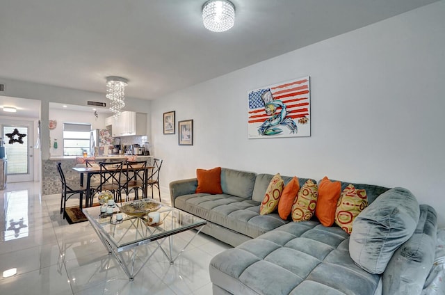 130 Lake Meryl Dr Unit 226, West Palm Beach, FL 33411 - living room with a chandelier and light tile patterned floors