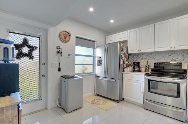 130 Lake Meryl Dr Unit 226, West Palm Beach, FL 33411 - kitchen featuring appliances with stainless steel finishes, white cabinets, light tile patterned floors, and recessed lighting