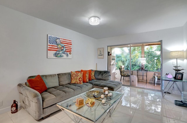 130 Lake Meryl Dr Unit 226, West Palm Beach, FL 33411 - living room featuring light tile patterned flooring and baseboards