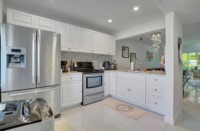 130 Lake Meryl Dr Unit 226, West Palm Beach, FL 33411 - kitchen featuring stainless steel appliances, a sink, light tile patterned floors, light countertops, and recessed lighting