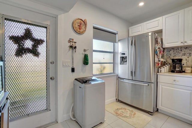 130 Lake Meryl Dr Unit 226, West Palm Beach, FL 33411 - kitchen with stainless steel refrigerator with ice dispenser, white cabinetry, decorative backsplash, light tile patterned flooring, and light countertops