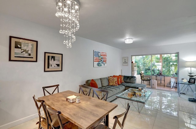 130 Lake Meryl Dr Unit 226, West Palm Beach, FL 33411 - dining room with light tile patterned flooring, baseboards, and a chandelier