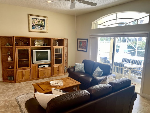 225 Clocktower Dr, Jupiter, FL 33458 - living area featuring a textured ceiling and a ceiling fan