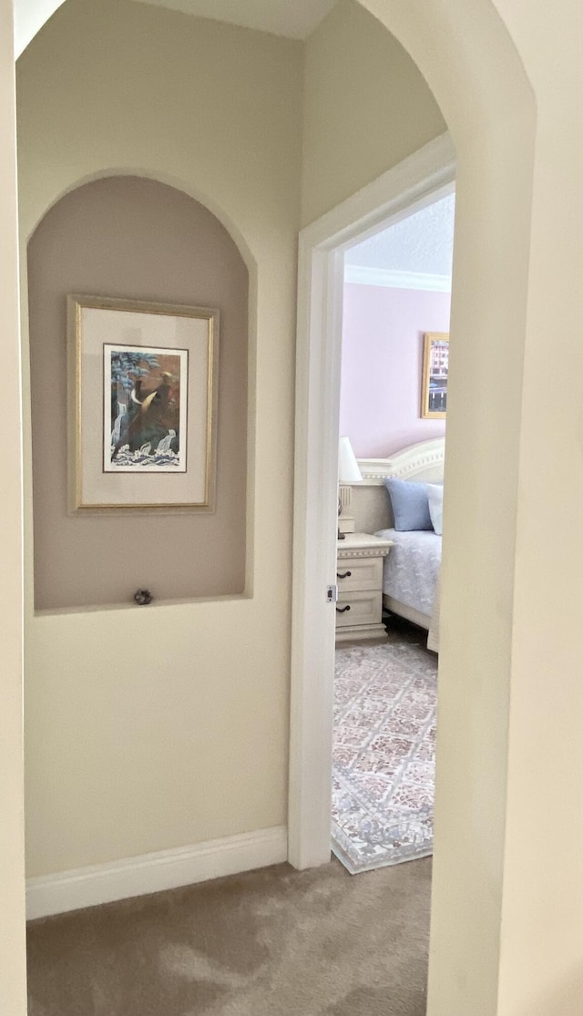 225 Clocktower Dr, Jupiter, FL 33458 - corridor with carpet flooring, baseboards, and arched walkways