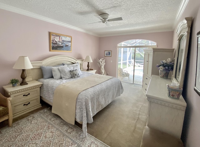 225 Clocktower Dr, Jupiter, FL 33458 - bedroom featuring access to outside, a textured ceiling, ornamental molding, ceiling fan, and light colored carpet