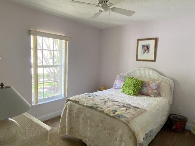 225 Clocktower Dr, Jupiter, FL 33458 - carpeted bedroom with baseboards and ceiling fan