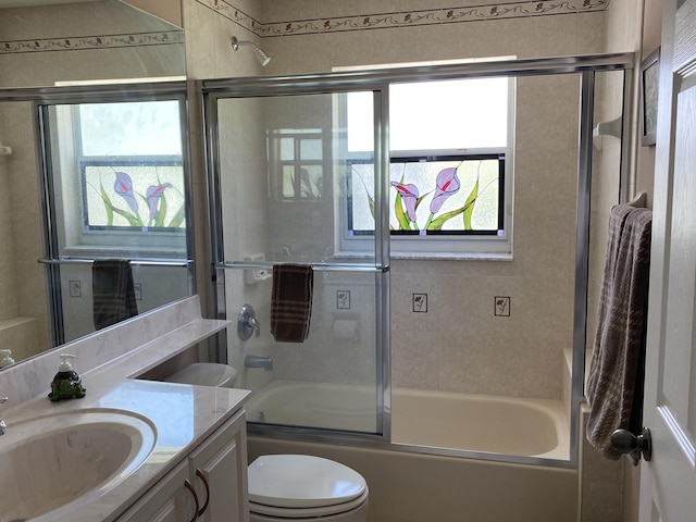 225 Clocktower Dr, Jupiter, FL 33458 - full bath featuring combined bath / shower with glass door, vanity, and toilet