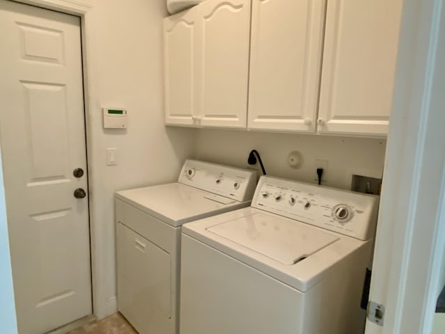 225 Clocktower Dr, Jupiter, FL 33458 - laundry area with independent washer and dryer and cabinet space