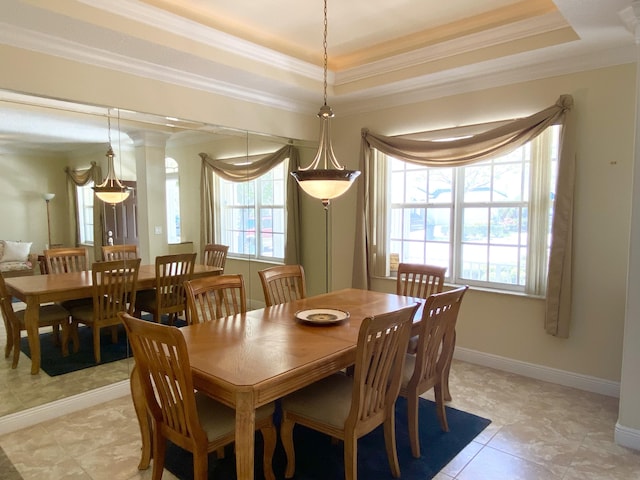 225 Clocktower Dr, Jupiter, FL 33458 - dining space with healthy amount of natural light, a raised ceiling, crown molding, and light tile patterned floors
