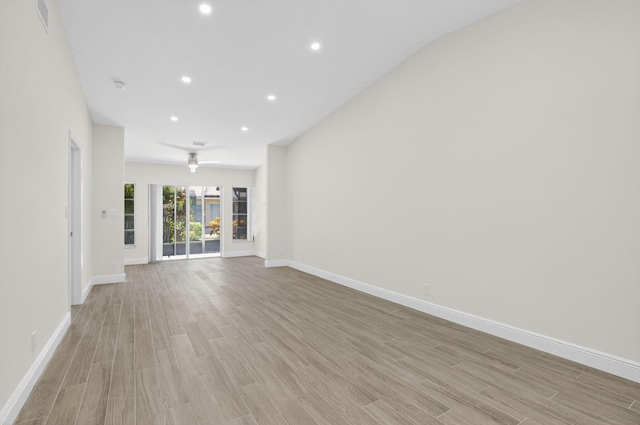 8583 Overset Ln Unit C, Boca Raton, FL 33496 - unfurnished living room with light wood-style floors and recessed lighting