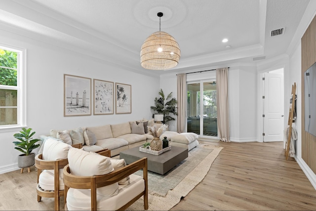 17564 Cinquez Park Rd W, Jupiter, FL 33458 - living room with a tray ceiling, light wood-type flooring, plenty of natural light, crown molding, and recessed lighting