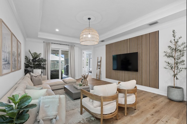 17564 Cinquez Park Rd W, Jupiter, FL 33458 - living area featuring light wood-style flooring, a tray ceiling, ornamental molding, recessed lighting, and baseboards