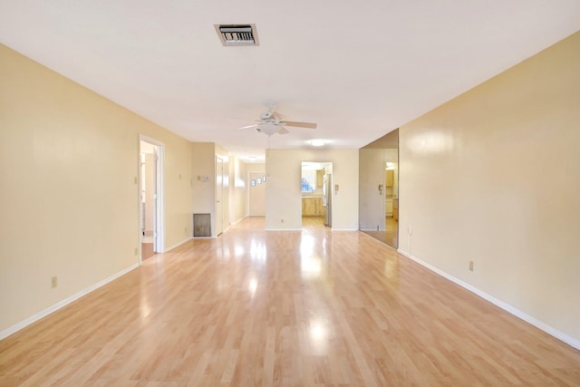 5730 Fernley Dr E Unit 28, West Palm Beach, FL 33415 - unfurnished living room with ceiling fan, light wood-type flooring, and baseboards