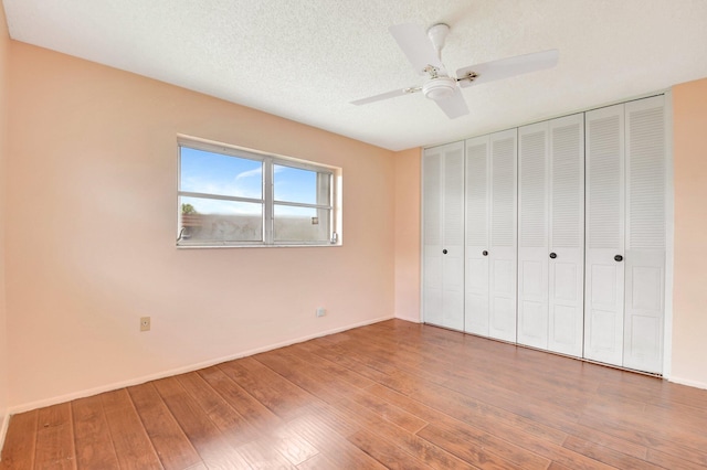 5730 Fernley Dr E Unit 28, West Palm Beach, FL 33415 - unfurnished bedroom with hardwood / wood-style floors, baseboards, a ceiling fan, and a closet