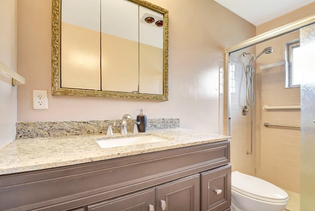 5730 Fernley Dr E Unit 28, West Palm Beach, FL 33415 - full bathroom featuring toilet, a stall shower, and vanity