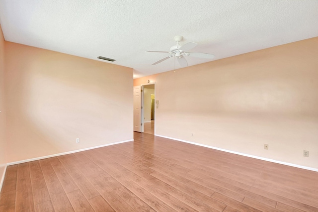 5730 Fernley Dr E Unit 28, West Palm Beach, FL 33415 - empty room featuring a ceiling fan, light wood-type flooring, baseboards, and a textured ceiling