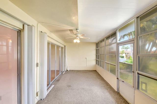5730 Fernley Dr E Unit 28, West Palm Beach, FL 33415 - unfurnished sunroom featuring a ceiling fan and carpet floors