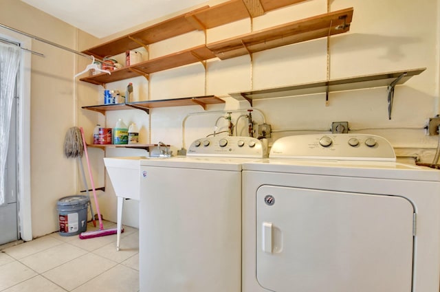 5730 Fernley Dr E Unit 28, West Palm Beach, FL 33415 - laundry room with independent washer and dryer and light tile patterned flooring