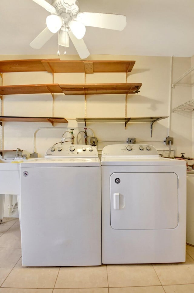 5730 Fernley Dr E Unit 28, West Palm Beach, FL 33415 - washroom featuring washing machine and clothes dryer, light tile patterned flooring, and a ceiling fan