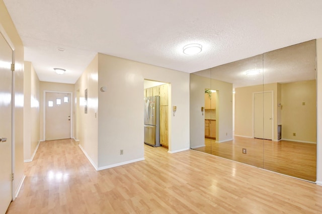 5730 Fernley Dr E Unit 28, West Palm Beach, FL 33415 - foyer with light wood-style flooring and baseboards