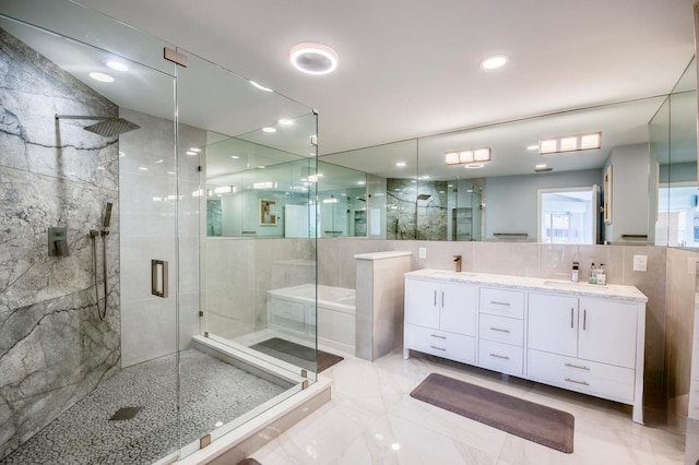 208 Legendary Cir, Palm Beach Gardens, FL 33418 - full bath with a shower stall, double vanity, a bath, and tile walls