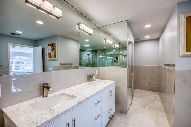 208 Legendary Cir, Palm Beach Gardens, FL 33418 - full bathroom with double vanity, a shower with shower door, and marble finish flooring