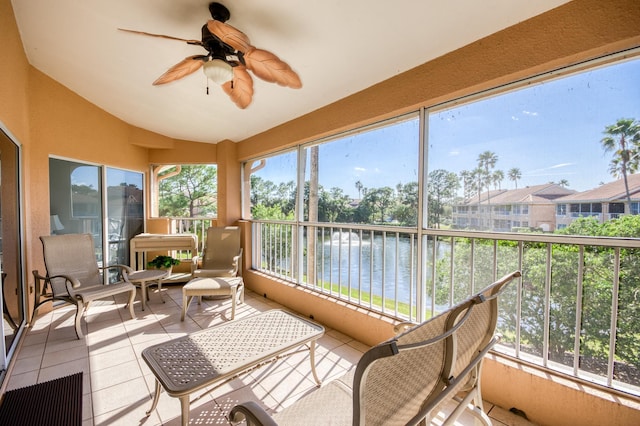 208 Legendary Cir, Palm Beach Gardens, FL 33418 - sunroom featuring vaulted ceiling, tile patterned floors, a ceiling fan, and a water view