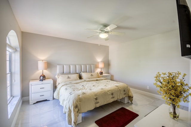 208 Legendary Cir, Palm Beach Gardens, FL 33418 - bedroom featuring light marble finish floors, ceiling fan, and baseboards