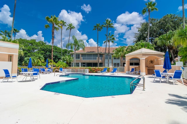208 Legendary Cir, Palm Beach Gardens, FL 33418 - community pool featuring a patio