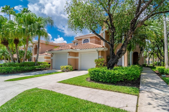 208 Legendary Cir, Palm Beach Gardens, FL 33418 - view of front of home with a garage, stucco siding, a tiled roof, and driveway