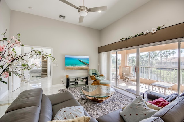 208 Legendary Cir, Palm Beach Gardens, FL 33418 - living area featuring a towering ceiling, ceiling fan, and baseboards