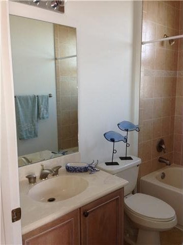 full bath with vanity, toilet, and shower / bath combination