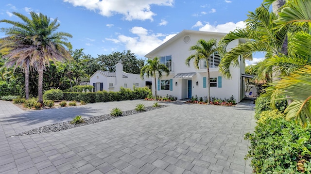 218 NE 10th St, Delray Beach, FL 33444 - mediterranean / spanish home with decorative driveway and stucco siding