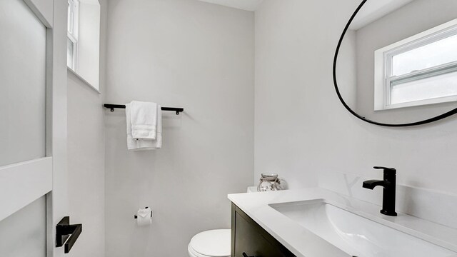 218 NE 10th St, Delray Beach, FL 33444 - half bath featuring vanity and toilet
