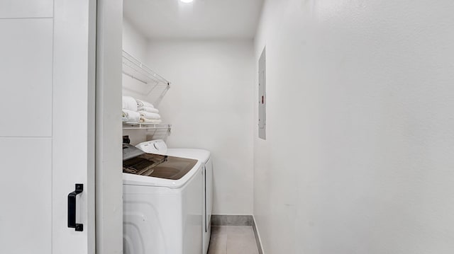 218 NE 10th St, Delray Beach, FL 33444 - washroom featuring washing machine and dryer, tile patterned floors, and baseboards