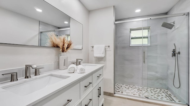 218 NE 10th St, Delray Beach, FL 33444 - bathroom featuring double vanity, a stall shower, and recessed lighting