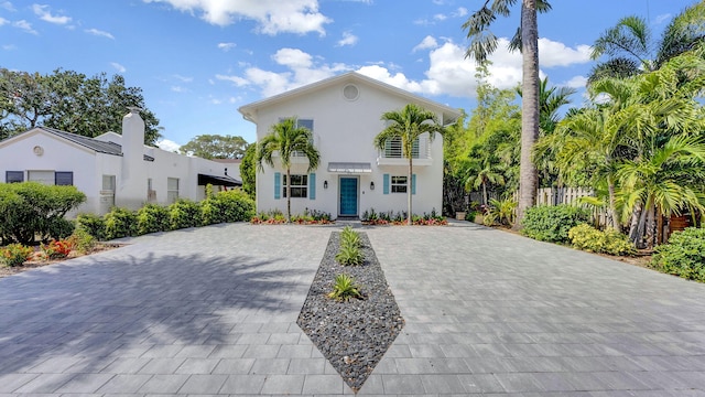 218 NE 10th St, Delray Beach, FL 33444 - mediterranean / spanish house featuring stucco siding and decorative driveway