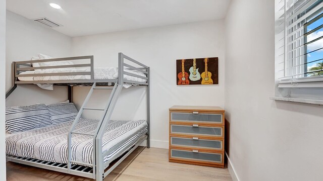 218 NE 10th St, Delray Beach, FL 33444 - bedroom featuring light wood finished floors, baseboards, and recessed lighting