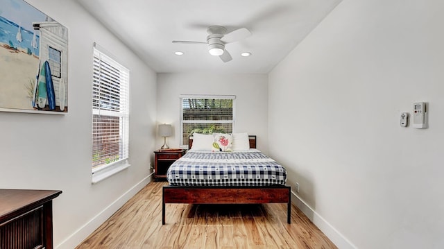 218 NE 10th St, Delray Beach, FL 33444 - bedroom featuring wood finished floors, multiple windows, baseboards, ceiling fan, and recessed lighting