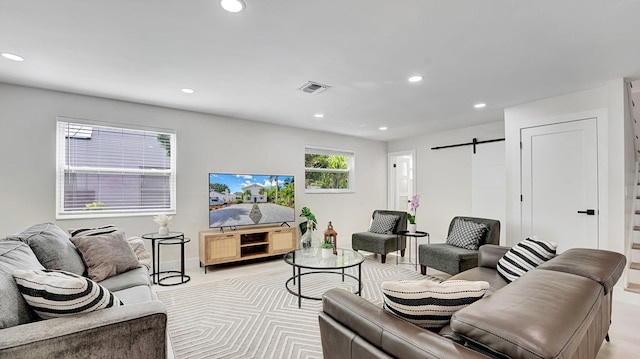 218 NE 10th St, Delray Beach, FL 33444 - living room with recessed lighting, a barn door, and baseboards