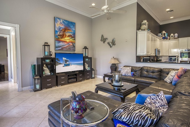 living room with crown molding, a ceiling fan, baseboards, light tile patterned flooring, and recessed lighting