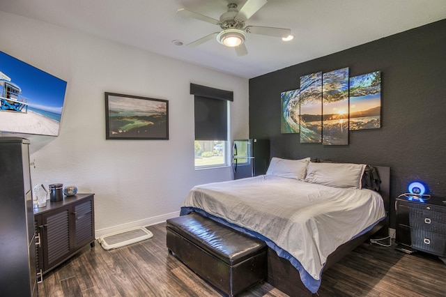 bedroom with wood finished floors, baseboards, and ceiling fan