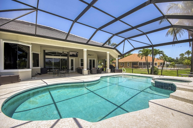 view of pool featuring a patio area, a ceiling fan, and glass enclosure