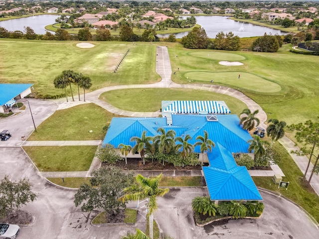 aerial perspective of suburban area with a large body of water and a golf course