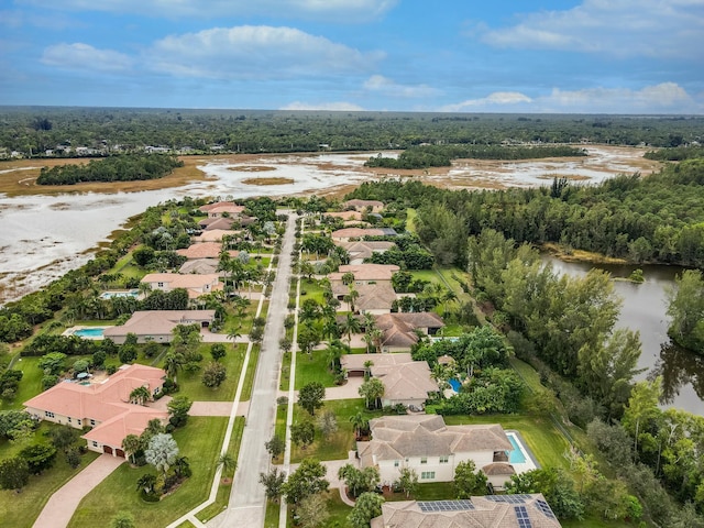 aerial perspective of suburban area with a large body of water
